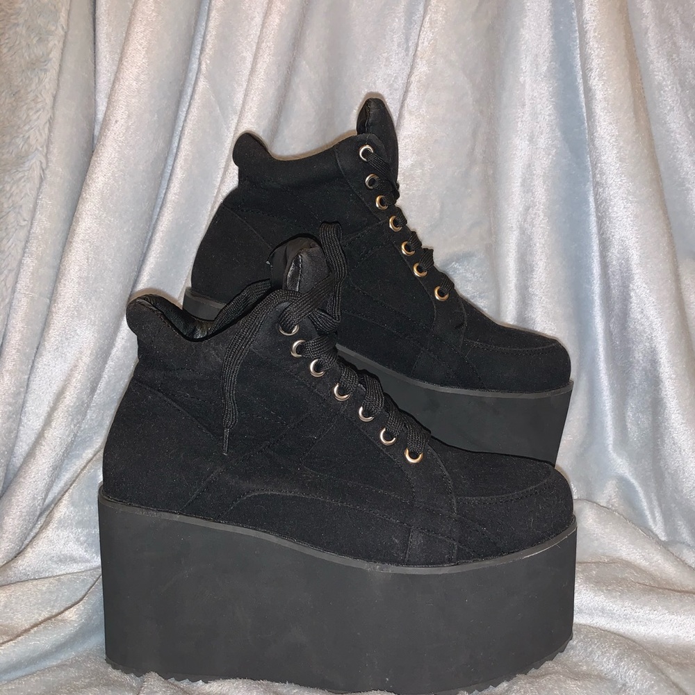Black lace up platform sneakers.
